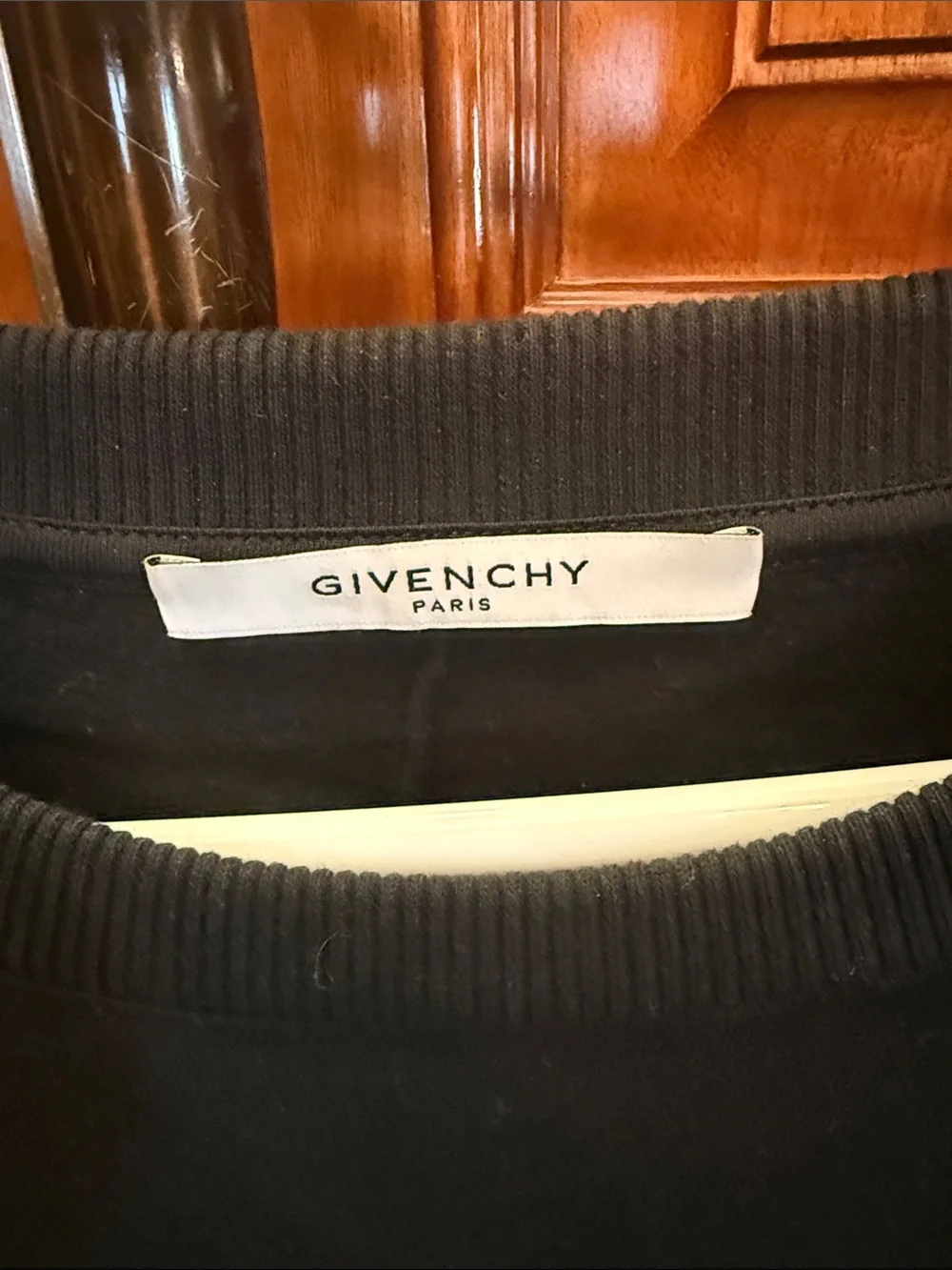 Givenchy Black Crewneck Sweater with White Star Circle and Red-Striped Sleeve